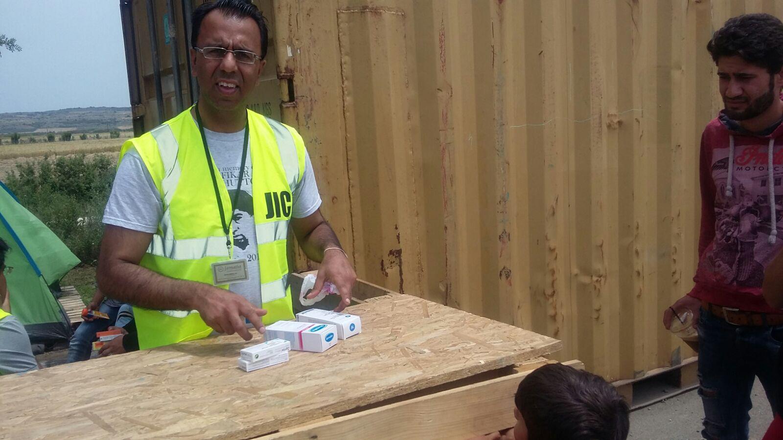 Mr Ali delivering medical aid in a refugee camp